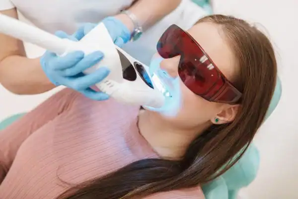 Woman having Blue Light Teeth Whitening Andover Andover